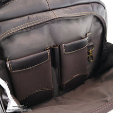Load image into Gallery viewer, Interior view of the backpack's front pocket. It features two cellphone pockets, a pen holder, and a small key sling.