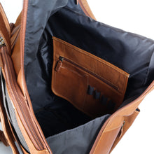 Load image into Gallery viewer, Interior view of the tan leather backpack's main compartment. The front end has a zipper pocket with four pen holders.