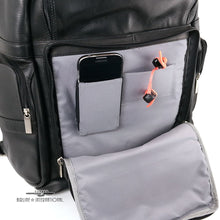 Load image into Gallery viewer, close up to the front panel pocket. A cellphone and earphones are tucked inside the dedicated pockets.
