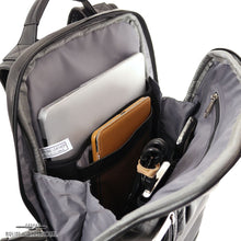 Load image into Gallery viewer, Interior view of the leather backpack's main compartment. A laptop, tablet, cables and cellphone are organized in the dedicated pockets.
