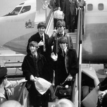 Load image into Gallery viewer, The Beatles photograph. Each member is seen walking down the steps, out of a plane.