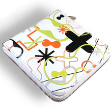 Load image into Gallery viewer, Angled view of the wallet, set on a white background. It is a white wallet with different shapes and designs in neon green, black, and orange. The zipper is white and the slider has the ACME logo on it.