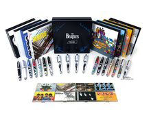 Load image into Gallery viewer, View of the included boxes with the pens and card cases arranged in front of them. Set on a white background.