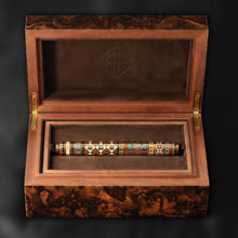 Load image into Gallery viewer, View of the Fountain Pen resting in its brown wood presentation box. Placed on a black background. The design of the box may vary per pen.