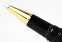 Load image into Gallery viewer, close up to the ACME logo by the grip section. Set on a white background.