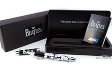 Load image into Gallery viewer, Arrangement of the outer box, presentation case, pamphlet, and rollerball with the cap placed behind it. Set on a white background.