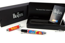 Load image into Gallery viewer, Arrangement of the second pen with the outer box, presentation case, and the pamphlet. The pen features chrome trims, a red cap with the band logo in yellow, and art portraits of each member on the barrel.