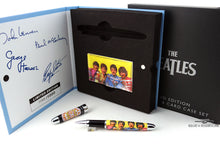 Load image into Gallery viewer, Arrangement of the Sergeant Pepper set showing the outer box, presentation box, pen, and card case. The cap has a white background with the Sergeant Peppers Lonely Hearts Club Band badge, and the barrel has the portrait of the Beatles with their uniforms. Set on a white background.