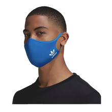 Load image into Gallery viewer, A model wearing the blue mask. It features the Adidas logo on the jaw area.