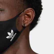 Load image into Gallery viewer, Close up to the model wearing the mask. The Adidas logo is placed in white.