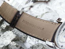 Load image into Gallery viewer, Close up to the inside of the watch strap. The embossing reads: CUIR VERITABLE.