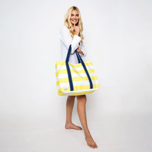 Load image into Gallery viewer, The tote in yellow and white straps being held by a model. Placed on a white background.