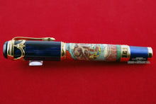 Load image into Gallery viewer, Side view of the Fountain Pen. Set on a red background.