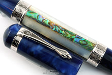 Load image into Gallery viewer, Close up to the abalone and cap clip. Set on a white background. The .925 stamp for Sterling Silver is seen on the rings of the pen's trims.