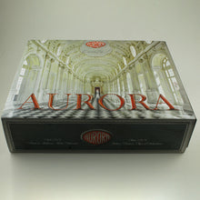 Load image into Gallery viewer, To view of the outer box sleeve on a white background. It features a printed image with the Aurora logo in red.