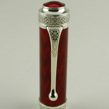 Load image into Gallery viewer, Front view of the cap clip on a white background. The top of the clip has engrave decorations.