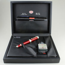 Load image into Gallery viewer, Front view of the fountain pen on the presentation box with the included ink bottle and documents. Placed on a white background.