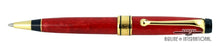 Load image into Gallery viewer, Front view of the ballpoint pen on a white background. The ring in the middle has an engraved series of lines that spell out the word "AURORA" along with some decorations.