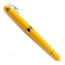 Load image into Gallery viewer, Back view of the Fountain Pen on a white background. It is yellow with gold-trimmed accents. The limited edition number is engraved in black on the cap.