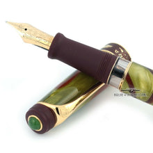 Load image into Gallery viewer, Close up to the Fountain pen with the cap placed under the grip section. Placed on a white background.