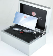 Load image into Gallery viewer, Angled view of the presentation box arranged with the pen and booklet included on  white background. 
The pen has a small red plastic tag with the Aurora logo tied to the clip.