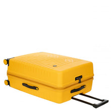 Load image into Gallery viewer, The mango yellow suitcase laid on its back. The front, side and top panels are visible.