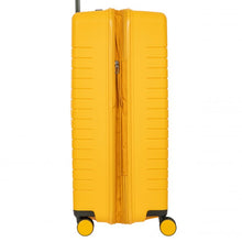 Load image into Gallery viewer, Side view of the mango yellow hard shell suitcase on a white background. The expandable feature is unzipped.