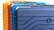 Load image into Gallery viewer, Top view of four suitcases arranged behind each other on a white background. From front to back: Navy blue, electric blue, red, and yellow.