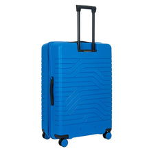 Load image into Gallery viewer, Angled back view of the 30-inch electric blue suitcase on a white background. It features a wave line design and black accents.