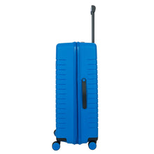 Load image into Gallery viewer, Side view of the 30 inch electric blue suitcase on a white background. The side features a black handle.
