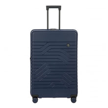 Load image into Gallery viewer, Front view of the 30 inch hard-shell navy blue suitcase. It features a wave pattern on the front, and a telescopic handle.