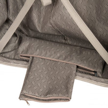 Load image into Gallery viewer, Close up to the bottom interior of the right panel. It features a small pouch holding a bag. It can be used to store laundry or a pair of shoes.