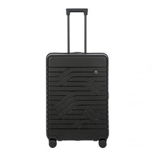 Load image into Gallery viewer, Front view of the black hard shell suitcase. it features a design of textured wave lines and a small circular logo with the BY initials at the top right.