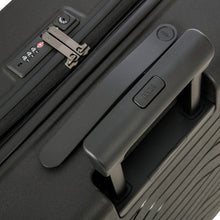 Load image into Gallery viewer, Close up to the top of the black suitcase. This section features a top handle and a three digit combination lock.