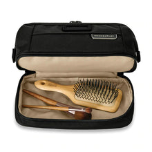 Load image into Gallery viewer, Briggs & Riley Baseline Duo Essentials Kit - Black
Image of Zippered Flat Bottom compartment ideal for larger hair or makeup brushes.
Height Width Depth Weight
US 5.5 in. 9.5 in. 4.8 in. .6 lbs.
EU 14 cm 24.1 cm 12.2 cm 0.3 kg