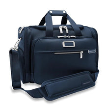Load image into Gallery viewer, Briggs & Riley Baseline Underseat Duffle - Navy
Image of Angled Front Panel View shown with adjustable shoulder strap.
Height	     Width	     Depth	    Weight
US	10.5 in.	16.5 in.	11.5 in.	2.8 lbs.
EU	26.7 cm	41.9 cm	29.2 cm	1.3 kg