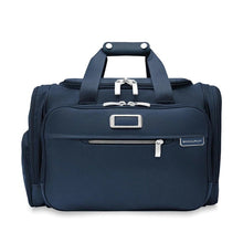 Load image into Gallery viewer, Briggs & Riley Baseline Underseat Duffle - Navy
Image of Front Panel View with monogram leather patch, allowing for up to 3 embossed initials
Height	     Width	     Depth	    Weight
US	10.5 in.	16.5 in.	11.5 in.	2.8 lbs.
EU	26.7 cm	41.9 cm	29.2 cm	1.3 kg