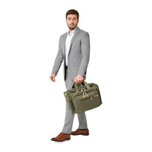 Load image into Gallery viewer, Briggs & Riley Baseline Underseat Duffle - Olive
Image of male model carrying the Olive Underseat Duffle
Height	     Width	     Depth	    Weight
US	10.5 in.	16.5 in.	11.5 in.	2.8 lbs.
EU	26.7 cm	41.9 cm	29.2 cm	1.3 kg