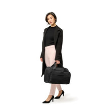 Load image into Gallery viewer, Briggs & Riley Baseline Expandable Cabin Bag - Black
Image of Expandable Cabin Bag shown carried by female model
Height	   Width	     Depth	    Weight
US	11 in.	17 in.	8 in.	        3 lbs.
EU	27.9 cm	43.2 cm	20.3 cm	1.4 kg