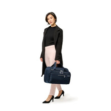 Load image into Gallery viewer, Briggs & Riley Baseline Expandable Cabin Bag - Navy
Shown being carried by female model
Height	   Width	     Depth	    Weight
US	11 in.	17 in.	8 in.	        3 lbs.
EU	27.9 cm	43.2 cm	20.3 cm	1.4 kg