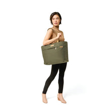 Load image into Gallery viewer, Briggs & Riley Baseline Travel Tote - Olive
Image of Travel Tote on female model's shoulder
Height	     Width	     Depth	     Weight
US	13 in.      21 in.       7.5 in.     1.6 lbs.
EU	33 cm    53.3 cm	19.1 cm	0.7 kg