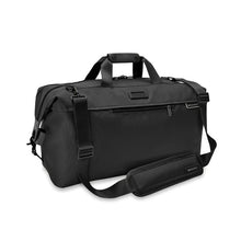 Load image into Gallery viewer, Briggs & Riley Baseline Weekender Duffle - Black
Image of Front Angled View.  Also showing adjustable shoulder strap.
Height	    Width	    Depth	    Weight
US	15.5 in.	20 in.     9 in.	      2.5 lbs.
EU	39.4 cm	50.8 cm	22.9 cm	1.1 kg