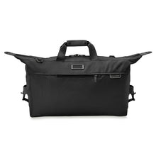 Load image into Gallery viewer, Briggs & Riley Baseline Weekender Duffle - Black
Image of Front Panel View. Side flaps securely cinch down with clasps, to reduce items from shifting in transit
Height	    Width	    Depth	    Weight
US	15.5 in.	20 in.     9 in.	      2.5 lbs.
EU	39.4 cm	50.8 cm	22.9 cm	1.1 kg