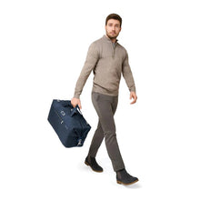 Load image into Gallery viewer, Briggs & Riley Baseline Weekender Duffle - Navy
Image of Duffle shown carried by male model
Height	    Width	    Depth	    Weight
US	15.5 in.	20 in.     9 in.	      2.5 lbs.
EU	39.4 cm	50.8 cm	22.9 cm	1.1 kg