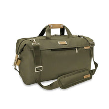 Load image into Gallery viewer, Briggs & Riley Baseline Weekender Duffle - Olive
Image of Front Angled View with adjustable shoulder strap
Height	    Width	    Depth	    Weight
US	15.5 in.	20 in.     9 in.	      2.5 lbs.
EU	39.4 cm	50.8 cm	22.9 cm	1.1 kg
