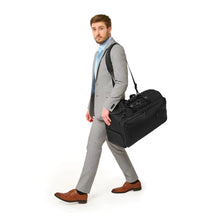 Load image into Gallery viewer, Briggs & Riley Baseline Garment Duffle - Black
Image of Model Carrying Garment Duffle with adjustable shoulder strap - included in purchase
Height	Width	Depth	Weight
US	12.5 in.	22 in.	9 in.	4.2 lbs.
EU	31.8 cm	55.9 cm	22.9 cm	2 kg