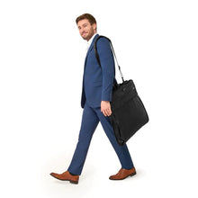 Load image into Gallery viewer, Briggs & Riley Baseline Classic Garment Cover - Black
Image of male model carrying the classic garment with the adjustable shoulder strap. Bag is shown folded in half for convenient transport.
Height Width Depth Weight
US 22.5 in. 24.5 in. 2 in. 3.2 lbs.
EU 57.2 cm 62.2 cm 5.1 cm 1.5 kg