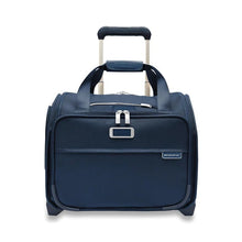 Load image into Gallery viewer, Briggs & Riley Baseline 2-Wheel Cabin Bag - Navy
Image of Front Panel View showing telescoping handle in lower stage.  Also showing leather monogram patch on front panel, which can be embossed with up to 3 initials.
Height	   Width	     Depth	     Weight
US	13.5 in.	15.5 in.	9.5 in.	6.5 lbs.
EU	34.3 cm	39.4 cm	24.1 cm	3 kg