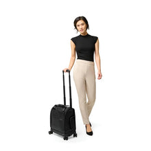 Load image into Gallery viewer, Briggs & Riley Baseline Cabin Spinner - Black
Image of female model wheeled the Briggs & Riley Baselne Cabin Spinner
Height	    Width	    Depth	      Weight
US	16 in.	14 in.	9.5 in.	7 lbs.
EU	40.6 cm	35.6 cm	24.1 cm	3.3 kg