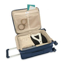 Load image into Gallery viewer, Briggs & Riley Baseline Global Carry-On Spinner - Navy
Image of Spacious Packing Capability in main compartment.  Also showing two zippered accessory pockets on inside lid for smaller articles.
Height	     Width	     Depth	       Weight
US	21 in.       15 in.	9 in.	         9.9 lbs. 
EU	53.3 cm	38.1 cm	22.9 cm	 4.5 kg